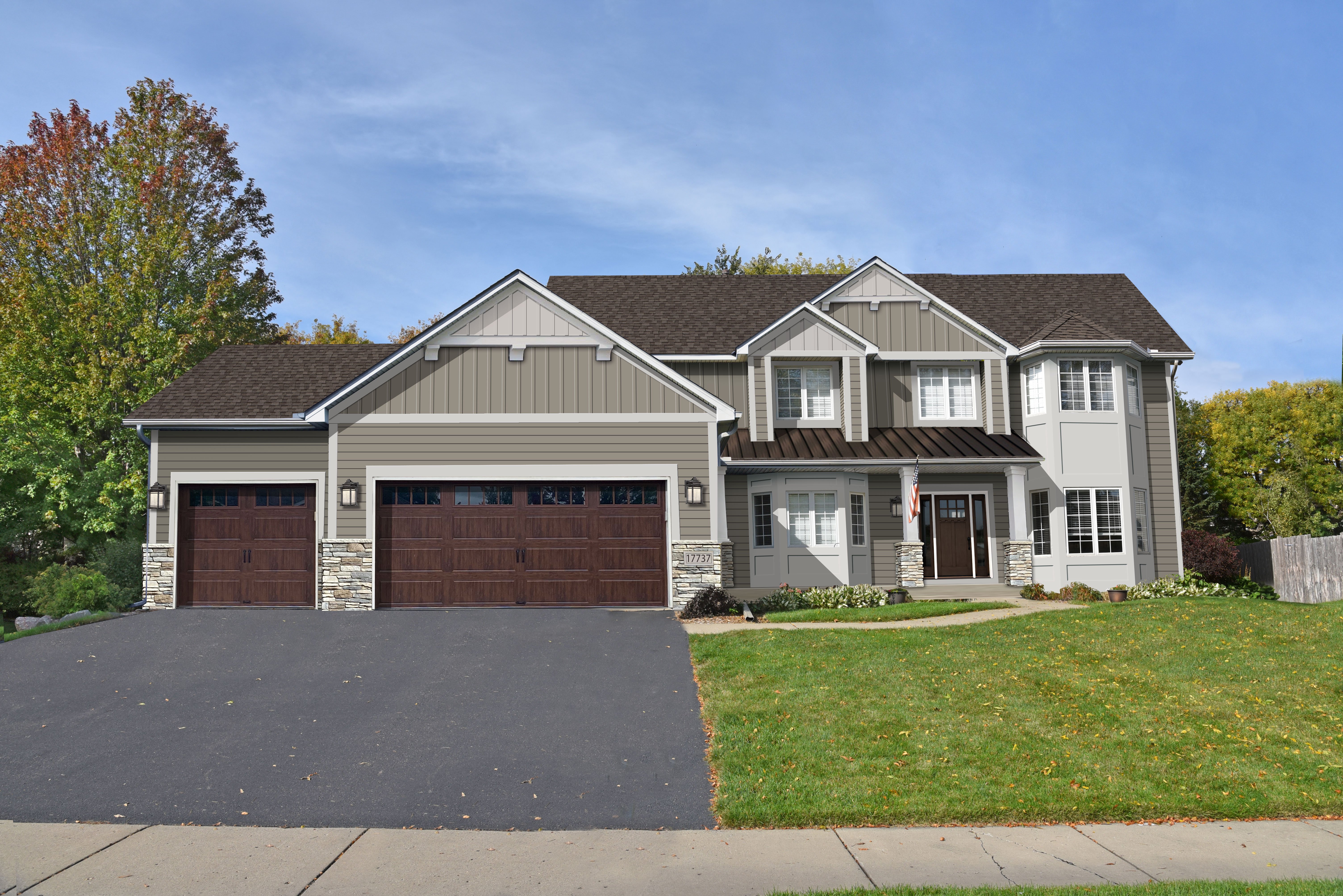 Exterior home design rendering — warm tan siding with brown carriage doors